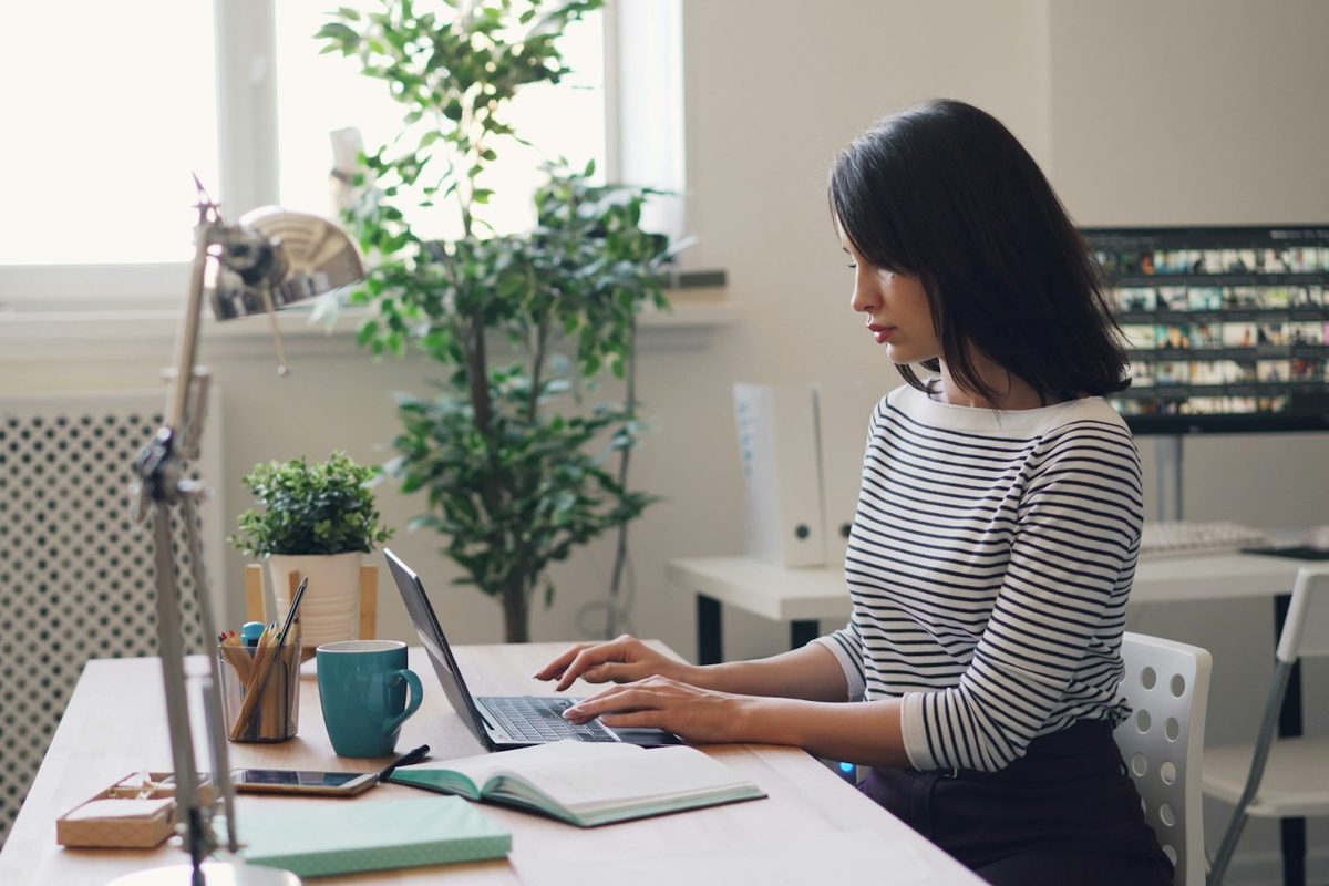 Two people going over figures on a laptop