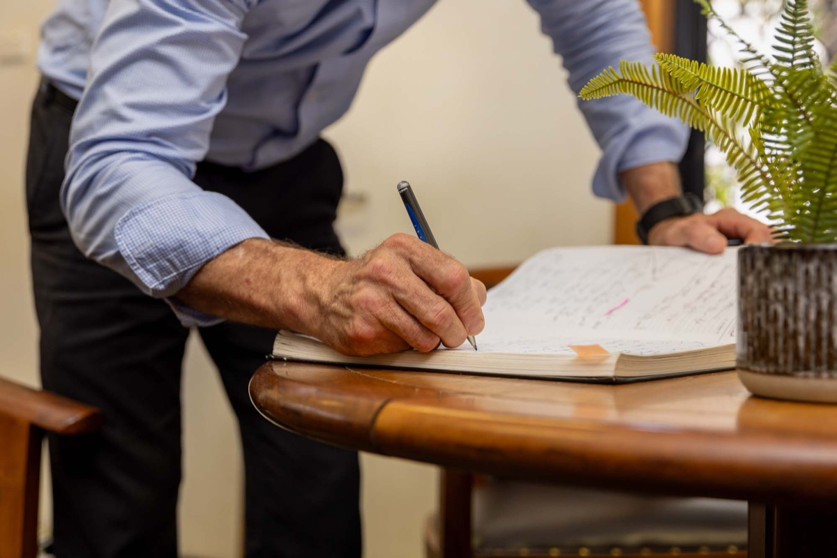A solicitor reviewing notes at a table