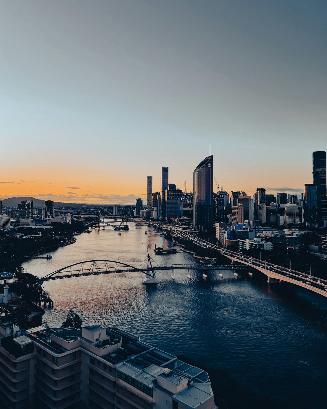 The Brisbane River at dusk, running between the CBD and the southside