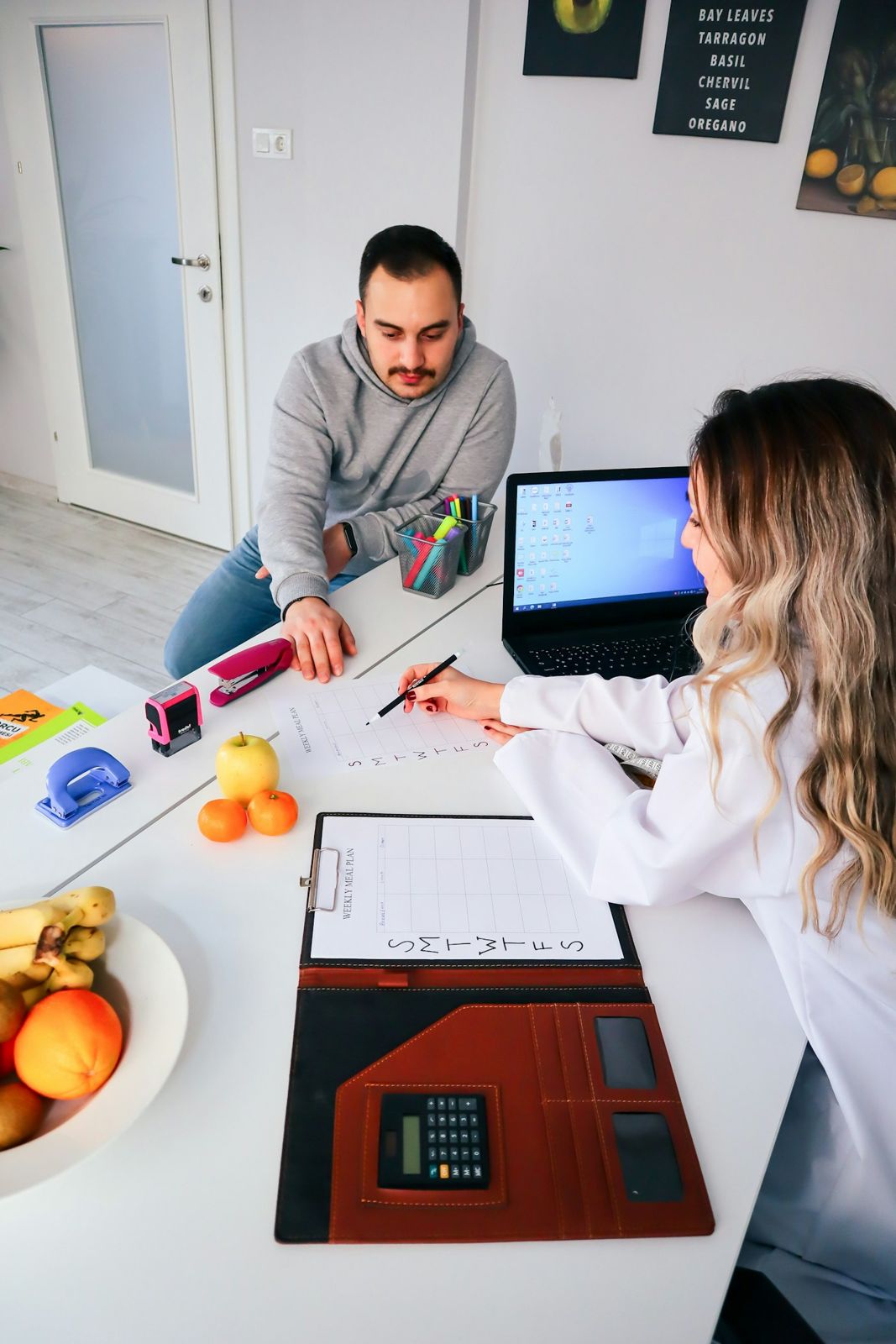 A couple working through home loan paperwork at the kitchen table