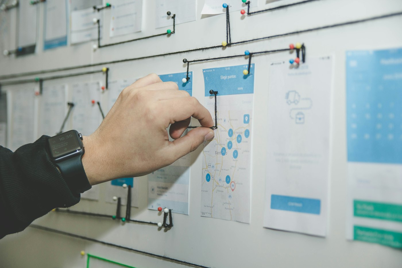 Someone mapping out a plan on a whiteboard