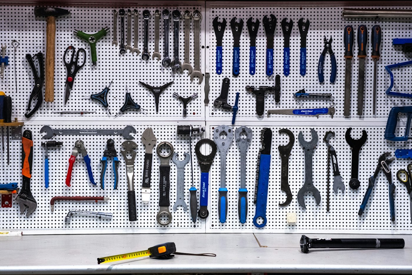 A wall of hand tools hanging in a workshop